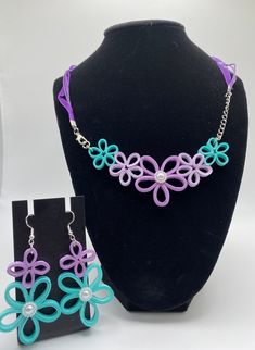 "You're looking at Quilling Unique Paper Quilling Necklace and Earrings set, Jewelry, floral purple turquoise , Valentines Gift A unique handmade paper quilled Necklace and earrings . Give your loved one a special gift with this beautiful set which are made using the ancient art of quilling. This is where one uses strips of paper which are rolled, shaped, and glued into decorative designs. These sets would be perfect for a special occasion like as : Birthday, Valentine's Day, Mother's Day, Weddi Multicolor Flower-shaped Jewelry With 3d Flowers, Multicolor 3d Flower Shaped Jewelry, Handmade Purple Jewelry Sets As Gift, Handmade Purple Flower-shaped Jewelry, Adjustable Green Jewelry With Handmade Flowers, Purple Flower-shaped Jewelry With Handmade Flowers, Purple Flower Jewelry With Handmade Details, Purple Flower Jewelry With Handmade Flowers, Purple Flower-shaped Handmade Jewelry