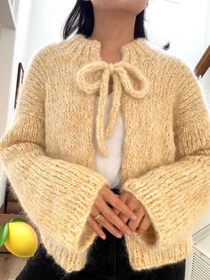 * THIS ITEM IS READY TO SHIP* (only 1 available) Inspired by Scandinavian design, this charming Lemonade Cardigan is versatile and cozy, featuring a playful bow tie and wide sleeves that create a relaxed, cute vibe. Entirely hand-knit with double strands of premium alpaca wool, it offers a luxuriously fluffy, soft feel while remaining thick and warm. Made entirely by hand with over 30 hours of care and dedication, this sweater is a true labor of love and craftsmanship. Perfect for those who love the look of mohair but need a gentle alternative, this alpaca blend provides the same fluffy texture without irritation--ideal for sensitive skin. Whether paired with jeans or a mini skirt, this cardigan adds warmth and charm to any outfit, wrapping you in a cozy hug all day long. Don't miss out on Mohair Cardigan Crochet, Gilet Mohair, Mohair Crochet, Crochet Mohair, Knitting Cardigan, Mohair Knit, Mohair Cardigan, Mini Sweater Dress, Mohair Sweater