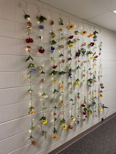 the wall is decorated with flowers and lights