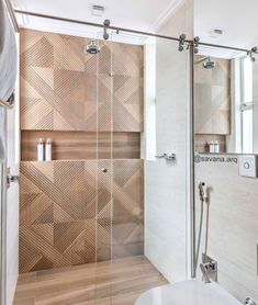 a walk in shower sitting inside of a bathroom