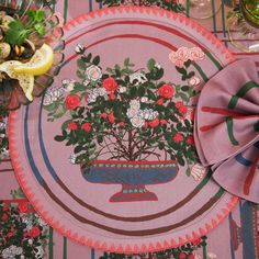 a pink place mat with flowers on it