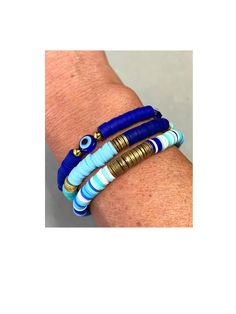 Gorgeous bracelet stack.  Stack comes with three bracelets made of of vibrant blues, teal greens and white mix with gold disc Heishi metal accent discs.  Perfect stack to add a good pop of color to your outfit. Adjustable Stacked Blue Bracelets, Blue Stackable Beaded Bracelets As Gift, Blue Spiritual Stackable Beaded Bracelets, Blue Bohemian Bracelets With Spacer Beads, Bohemian Blue Friendship Bracelets With Spacer Beads, Bohemian Blue Bracelets With Spacer Beads, Blue Stacked Beaded Bracelets, Blue Stacked Bracelets With Round Beads, Adjustable Blue Stackable Stretch Bracelet