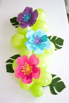 balloon flowers and grapes on a table