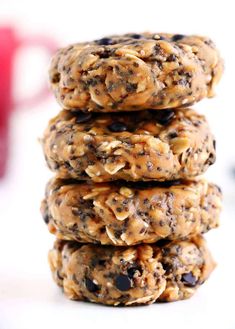 three cookies stacked on top of each other with chocolate chips and oats in the middle