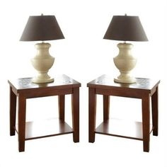 two wooden tables with lamps on them against a white background and one has a black shade