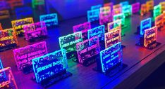 many different colored lights on a wooden table