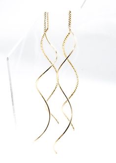 Artisanal & Unique!  These gorgeous minimalist thin gold swirl coil curved cable threader dangle earrings are designed and hand crafted to perfection with thin gold plated metal curved wires and chain.  Lightweight and comfortable, these gorgeous earrings are hand-made by creative artisans and the style is modern, minimalist, timeless & unique! ☆ Specifications: * Each Curved Threader Wires 2 1/4" Long - Measures  5" Long Total Length * Triple Gold Plated Metal Wires * Lead, cadmium & nickel-fre Cable Wire, Gorgeous Earrings, First Class, Favorite Jewelry, Jewelry Earrings Dangle, Swirl, Dangle Earrings, Etsy Accessories, Jewelry Earrings