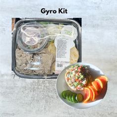 an open lunch box with food in it and the words gyro kit next to it