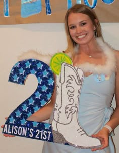 Cute college sorority girl holds 21 sign at her 21st birthday party. The custom glitter 21 sign from ECMadeIt features a blue star pattern and a white cowboy boot with a lime. The sign reads Alison's 21st. Turquoise 21st Birthday Ideas, 21st Birthday Ideas Country, 21 Signs Birthday, 21 Necklace Sign, 21st Birthday Necklace Sign, 21 Birthday Sign Around Neck, Sign Night 21st Birthday Themes, Nashville 21st Birthday Ideas, Country 21st Birthday Ideas