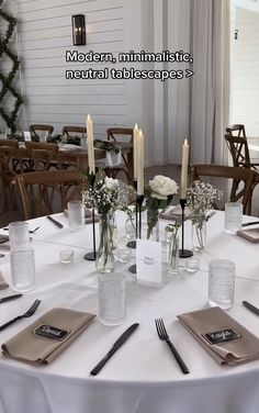 the table is set with candles and place settings