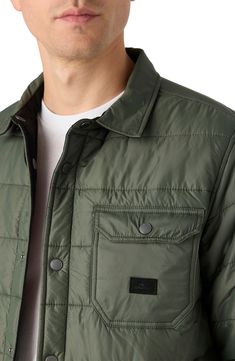 This quilted shirt jacket with rugged twill on the reverse gives you two outerwear options as the temps begin to drop. 30" length Front snap closure Snap cuffs Front welt pockets; chest snap-flap patch pocket Lined, with 100% polyester fill 100% polyester Machine wash, tumble dry Made in China Rugged Button-up Outerwear With Patch Pockets, Urban Quilted Jacket With Pockets For Fall, Rugged Long Sleeve Outerwear With Padded Collar, Casual Quilted Utility Jacket With Long Sleeves, Casual Quilted Utility Jacket For Work, Casual Quilted Jacket With Patch Pockets, Casual Quilted Jacket With Patch Pockets And Long Sleeves, Casual Quilted Jacket With Patch Pockets For Fall, Casual Button-up Quilted Jacket With Pockets