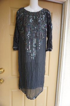 "Vintage sequined dress. Great vintage condition!! size estimated M. Measurements taken across front lying flat armpit to armpit 20\" 19\" across waist 20\" across hips 43\" length" Sequin Dress For Cocktail, Sequin Dress For Evening Party Season, Beaded Sequin Dress For Party Season Night Out, Holiday Cocktail Sequin Beaded Dress, Holiday Party Sequin Beaded Dress, Holiday Party Beaded Sequin Dress, Festive Beaded Sequin Dress For Night Out, Vintage Evening Sequin Dress, 90s Formal