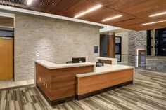 an empty reception area in a modern office building