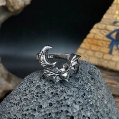 🐬Product Name：Vampire Bat Rings Moon Ring 🐬Material：Copper 🐬Band color：Silver 🐬Style：art decor,Christmas gift,new year,Anniversary 🐬Personalized：Yes 🐬Recycled：Yes 🐬Occasion : Anniversary / Daily / Wedding / Gift / Party/birthday/Valentine's Day/Engagement/Mother's Day/Father's Day 🐬Metal:Copper 🐬Metal Color:Silver 🐬Style:Art Decor,Hiphop,party,dance,Halloween Gift, 🐬About Size:Height: about 1.80cm Thickness: about 0.16cm Width: about 0.31cm We can provide personalize ring sizes of 7-12 US size, if you need other sizes, please contact customer service in advance to customize for you, thank you Personalized：Our rings can be engraved with your custom name, or a date that is Commemorative significance special to you 💎About customize Jewelry💎 1. Tell the customer service the custom Black Metal Rings For Halloween, Punk Black Ring For Halloween, Black Punk Rings For Halloween, Punk Black Rings For Halloween, Silver Emo Jewelry For Halloween, Grunge Style Rings For Halloween Gift, Adjustable Punk Rings For Halloween, Silver Punk Jewelry For Cosplay, Silver Grunge Style Jewelry For Cosplay