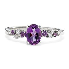 This sterling silver ring features a natural amethyst gemstone at its center for a pretty pop of color. Staggered natural amethyst and diamond accents create a floral look. Fine Jewelry Purple Amethyst Ring With Gemstone Accents, Fine Jewelry Purple Diamond Ring With Gemstone Accents, Purple Diamond Ring With Gemstone Accents, Elegant Purple Diamond Ring With Gemstone Accents, Purple Birthstone Ring With Gemstone Accents, Fine Jewelry Purple Amethyst Ring With Center Stone, Fine Jewelry Amethyst Diamond Ring In Purple, Purple Gemstone Birthstone Ring, Fine Jewelry Purple Rings With Gemstone Accents