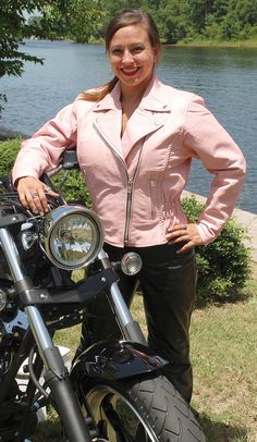 Shades of pink leather can vary from photo. Brighten up your leather riding wardrobe with this pink leather jacket. This women's motorcycle jacket is made of soft premium buffalo leather. A ladies biker jacket that comes with braid trim, zip out liner, two zippered front pockets, inside chest pocket, inside cell phone pocket, pen pocket, zip cuffs, and elastic stretch sides. Sizes: XS, S, M, L, XL, 2X, 3X, 4XL, 5XL. +$10 for 2X-3X.+$20 for 4XL-5XL [6#] leather braid trim snap down collar stretch Pink Fitted Long Sleeve Biker Jacket, Pink Leather Jacket With Zipper Closure And Long Sleeves, Pink Fitted Biker Outerwear, Fitted Pink Biker Outerwear, Pink Biker Style Long Sleeve Outerwear, Pink Biker Outerwear With Long Sleeves, Pink Biker Outerwear With Zipper Closure, Fitted Pink Biker Leather Jacket, Fitted Long Sleeve Pink Leather Jacket