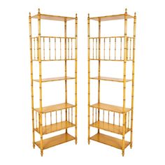 a pair of gold bamboo shelves on wheels