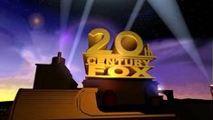 the 20th century fox logo is lit up in front of purple and blue sky at night