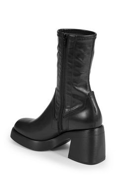 Enhance your ensemble with a bit of drama in this stretchy, contour-hugging boot set on a square-toe platform and conspicuously chunky block heel. 3 1/4" heel 9 1/4" shaft Side zip closure Synthetic upper/leather lining/synthetic sole Imported Modern Fitted Ankle Platform Boots, Modern Fitted Platform Boots, Modern Square Toe Platform Boots, Leather Boots Outfit, Platform Boots Women, Chunky Block Heels, Chunky Platform, Boots Outfit, Platform Boots