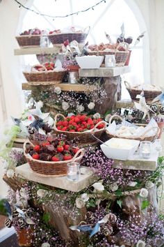 a table topped with lots of baskets filled with food