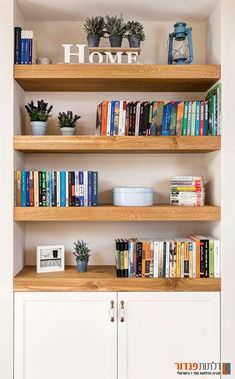 the bookshelf is filled with many different types of books and plants on it