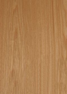 a close up view of a wooden surface with grainy woodgrain on it