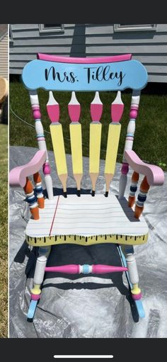 a child's rocking chair with crayons on it and the name mrs tilley