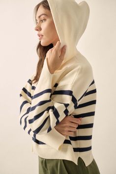 Breton stripe knit sweater. Attached hood. Long sleeves with split cuffs. Drop shoulder. Side-split hem. Ribbed knit cuffs and hem. Relaxed fit. 51% Viscose, 27% Polyester, 22% Nylon. Imported. Designed in LA. Model wears size S. Stripe Knit Sweater, Perfect Storm, Knit Hoodie, Hooded Sweater, Split Hem, Knit Cuff, Striped Knit, Hoodie Sweater, Striped Long Sleeve