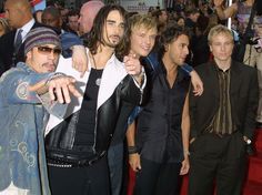 the group of young men are posing together on the red carpet at the movie premiere