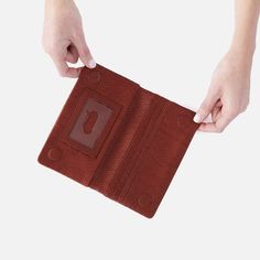 The wallet that inspired the Lumen Collection, this bifold wallet is the perfect balance of function and style. Lumen Continental Wallet In Soft Embossed Leather  Tuscan Brown LARGE WALLET in Tuscan Brown | Hobo® Versatile Bifold Wallet With Card Slots, Versatile Leather Trifold Wallet With Card Slots, Bifold Wallet With Magnetic Closure For Daily Use, Daily Use Bifold Wallet With Magnetic Closure, Brown Bifold Wallet With Magnetic Closure, Travel Textured Leather Bifold Wallet, Bifold Clutch With Interior Card Slots For Daily Use, Leather Trifold Wallet With Magnetic Closure For Travel, Textured Leather Bifold Wallet For Daily Use