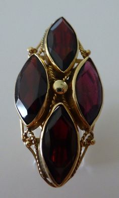 "Very unique vintage 14kt yellow gold filigree crafted setting with four marquise garnets (15mm x 6mm) placed in a diamond shape. Measures approximately 1-1/2\" x 3/4\" and weighs 4.7 dwt(7.3 grams). Ring size 6-1/4 Pre-owned age appropriate condition." Braided Wedding Band, Garnet Ring Vintage, Antique Rings Vintage, January Birthstone Rings, Garnet Jewelry, Fancy Jewellery, Vintage Jewels, Multi Stone Ring, Summer Jewelry