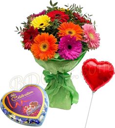 a bouquet of flowers and a heart shaped balloon next to a box of chocolates