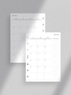 two blank calendars on top of each other