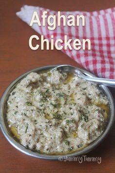 an image of a bowl of food on a table with the words afghan chicken in it