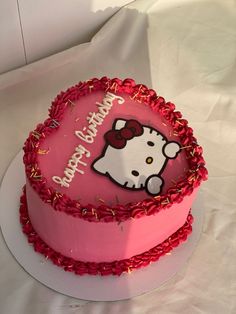 a hello kitty birthday cake on a plate