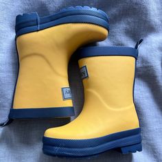 Yellow And Navy Toddler Rain Boots. New Without Tag. Size 4c Weatherproof Round Toe Rain Boots, Playful Round Toe Boots For Outdoor, Playful Waterproof Boots With Round Toe, Playful Waterproof Round Toe Boots, Cute Waterproof Boots With Round Toe, Cute Outdoor Boots With Round Toe, Casual Non-slip Boots For School, Playful Non-slip Boots With Round Toe, Yellow Round Toe Rain Boots For Spring