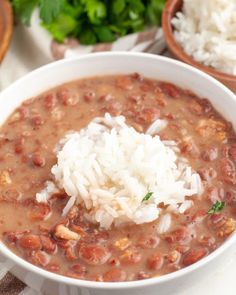 a white bowl filled with beans and rice