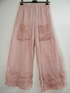 Summer Ruffled Relaxed Fit Pants, Summer Ruffle Pants With Relaxed Fit, Casual Ruffled Trousers, Casual Solid Color Pants With Ruffles, Casual Ruffled Relaxed Fit Pants, Pink Linen Pants With Pockets, Casual Wide-leg Pants With Ruffles, Chic Ruffled Linen Bottoms, Chic Linen Bottoms With Ruffles