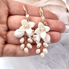 Elegant and romantic, this exquisite pair of earrings is a trendy accessory for your Special Day. Adorned with a combination of delicate ceramic flowers and natural pearls on a yellow gold / silver / rose gold base, it will add an extra touch of glam to finish off your perfect look on your perfect day. Length - 2.4" (approx. 6cm); Width - 0.9" (approx. 2.3cm); Weight - 3.8g. Cast in lightweight alloy and yellow gold / silver / rose gold plated for a flawless finish, the earrings are hypoallergen Ceramic Flowers, Trendy Accessories, Perfect Day, Natural Pearls, Silver Roses, Silver Rose Gold, Wedding Hair Accessories, Bridal Earrings, Rose Gold Plates