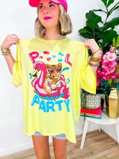 Dive into summer vibes with our Pool Party Tee! Embrace the oversized comfort adorned with a playful pool party-inspired print on the front, accentuated by dazzling rhinestone trim detailing. Whether it's a beach day or poolside lounging, this tee is your ultimate go-to, doubling as a chic swimsuit cover-up. PRODUCT FIT - OVERSIZED FIT MODEL DETAILS - BRENNA IS A SIZE SMALL, 5'3" FABRIC CONTENT - 100% COTTON CARE INSTRUCTIONS - HAND WASH COLD LAY FLAT TO DRY *PICTURES ARE EDITED TO ENHANCE COLOR Printed Yellow T-shirt For Vacation, Yellow Printed T-shirt For Vacation, Fun Summer T-shirt For Beach Party, Graphic Print Swimwear For Poolside Summer, Playful Graphic Print Swimwear, Playful Graphic Print T-shirt For Vacation, Casual Summer Party Tops, Spring Graphic Print Swimwear For Pool, Graphic Print Swimwear For Pool And Summer