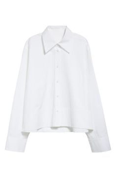 Forget business as usual. The classic poplin button-up gets a contemporary reboot in this slightly cropped, boxy rendition with an exaggerated collar and wide-set sleeves. 25" length (size 44 EU) Front button closure Spread collar Long sleeves with one-button cuffs Side slits 100% cotton Dry clean Made in Italy Designer Clothing Modern Poplin Shirt For Work, Chic Poplin Shirt For Work, Collared Poplin Shirt For Office, Modern Poplin Blouse For Work, Modern Poplin Shirt For Workwear, Boxy Cropped Button Down Shirt, Classic White Cropped Shirt With Button Closure, Cotton Cropped Button-up Shirt For Daywear, Chic Poplin Button-up Shirt