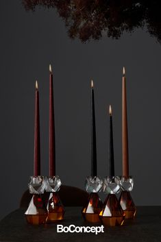 three candles sitting next to each other on top of a table