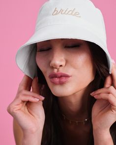 Made in the shade.|| Bathing Suit? Check. Sunscreen? Check. Bucket Hat? Check. It's all about sun protection this summer, ladies. Say bye bye to wrinkles and sun spots with our bride bucket hat - designed to keep you made in the shade all summer long. 100% cotton Beige embroidered logo Relaxed fit, 22" diameter Bucket Hat Design, Say Bye, Cotton Hat, Bye Bye, Bathing Suit, Sun Protection, Sunscreen, Bathing Suits, Wrinkles