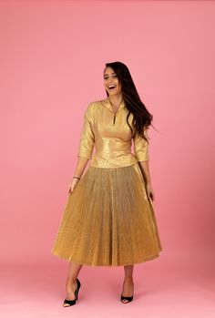 "A gorgeous 1950's Anita Bari of New York designer ensemble that will light up any room! This alluring matching set is made of an opulent metallic gold-lamé with a beautifully pleated skirt construction. This really gives the lamé depth and a bit of a soft sheen sparkle. The blouse has a chic collared plunge with 3/4-length sleeves. I love the hourglass nipped-waist design which flows into lined full swing-skirt. This is the type of look celebrity vixens, like Marilyn Monroe, made infamous. Extr Glamorous Gold Skirt For Evening, Glamorous Gold Evening Skirt, Retro Fitted Skirt For Party, Elegant Pleated Gold Skirt, Elegant Gold Pleated Skirt, Elegant Cocktail Skirt For Festive Occasions, Vintage Fitted Evening Skirt, Elegant Full Skirt In Gold, Festive Fitted Evening Skirt