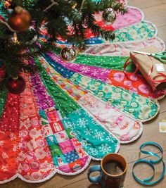 a christmas tree skirt is on the floor next to scissors