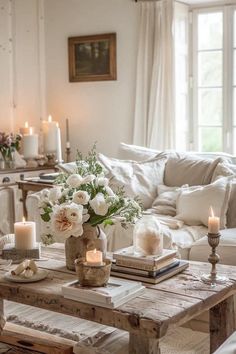 a living room filled with furniture and candles