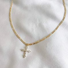 Delicate Chain Necklace With Cross Pendant, Gold Plated Cross Necklace With Adjustable Chain, Gold-plated Cross Necklace With Adjustable Chain, Gold Chain Jewelry With Cross Pendant, Gold Cubic Zirconia Crucifix Necklace, Figaro Chain Cross Pendant Necklace For Gift, Dainty Cubic Zirconia Cross Necklace, Dainty Cross Necklace In Cubic Zirconia, 14k Gold Filled Cross Necklace