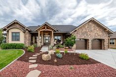 a large house with landscaping in front of it