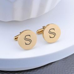 These classicaclly customized cufflinks are a great gift for any man. They look great on the groom, groomsman, or father of bride or groom! Each cufflink is engraved with a single initial. CUSTOM ENGRAVING: BOTH CUFFLINKS: [Initial] DETAILS: MATERIAL: stainless steel SHAPES: round or square FINISHES: gold, gunmetal, rose gold, stainless steel DIMENSIONS: 5/8 inch Elegant Engraved Cufflinks As Gift, Classic Personalized Adjustable Cufflinks, Elegant Cufflinks With Engraving Option For Father's Day, Elegant Gold Cufflinks With Initials, Gold Cufflinks For Wedding, Classic Personalized Initials Cufflinks, Classic Initials Cufflinks For Personalized Gift, Classic Personalized Round Cufflinks, Classic Round Personalized Cufflinks