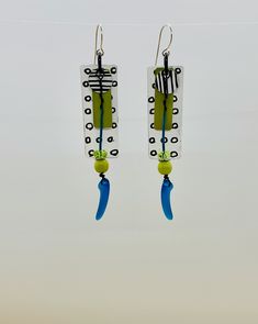 These super light weight earrings featured hand painted recycled aluminum in bold black and white with an accent of blue and chartreuse.   They are truly one of a kind!  As always, my ear-wires are 22 gauge sterling silver, hypoallergenic Bold Handmade Blue Earrings, Bold Blue Handmade Earrings, Artistic Turquoise Earrings With Ear Wire, White Artsy Earrings With Ear Wire, Artsy White Earrings With Ear Wire, Artsy Black Earrings With Ear Wire, Artistic Blue Earrings With Ear Wire, Handmade Black Contemporary Earrings, Contemporary Handmade Black Earrings